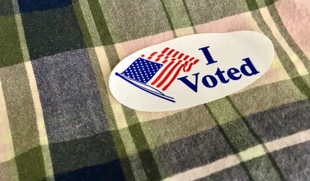 Image of a sticker with the words "I Voted" printed on it.